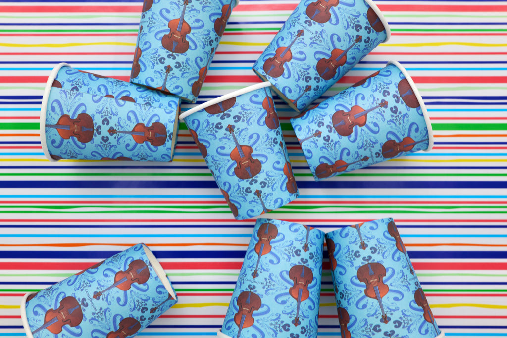 Blue 9 oz paper cups with repeating double bass pattern on striped background