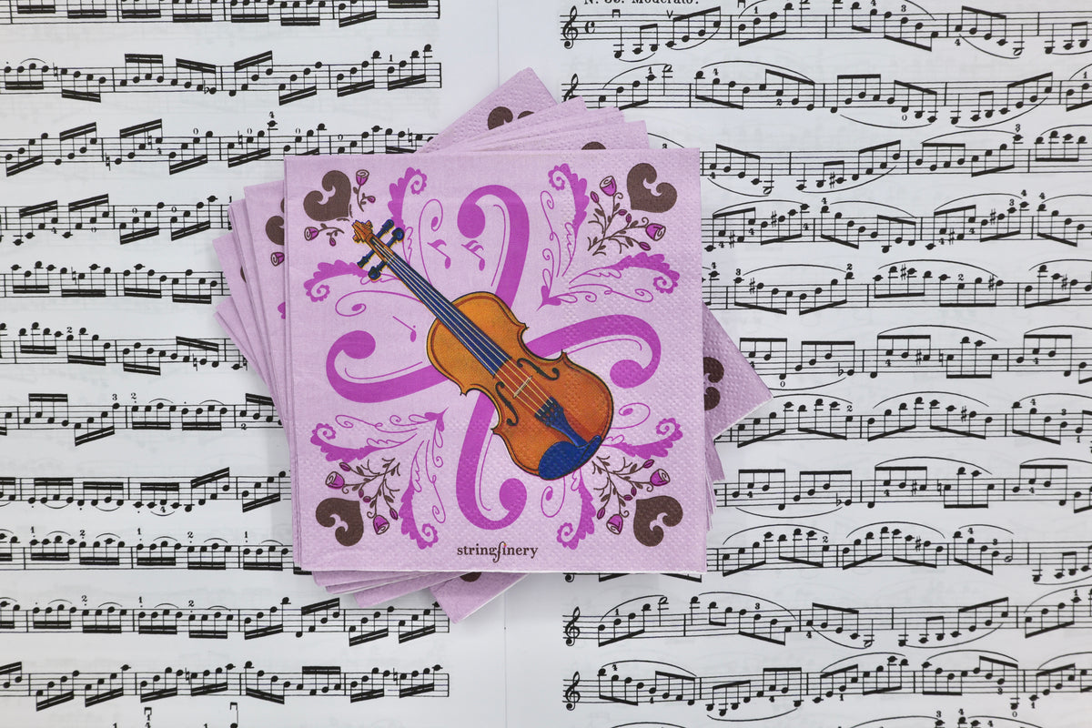 Pink 5-inch paper napkins with violin design and decorative musical pattern on sheet music