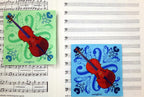 Eau de Nil and blue 5-inch paper napkins with cello design and decorative musical pattern on sheet music